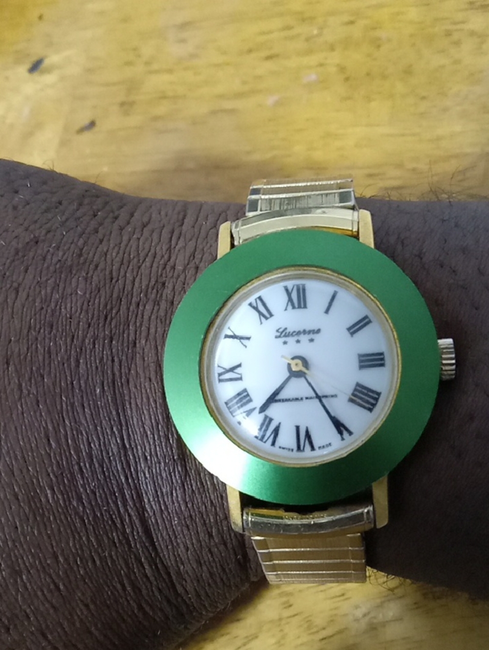 Lucerne Gold Tone Watch with Green Bezel